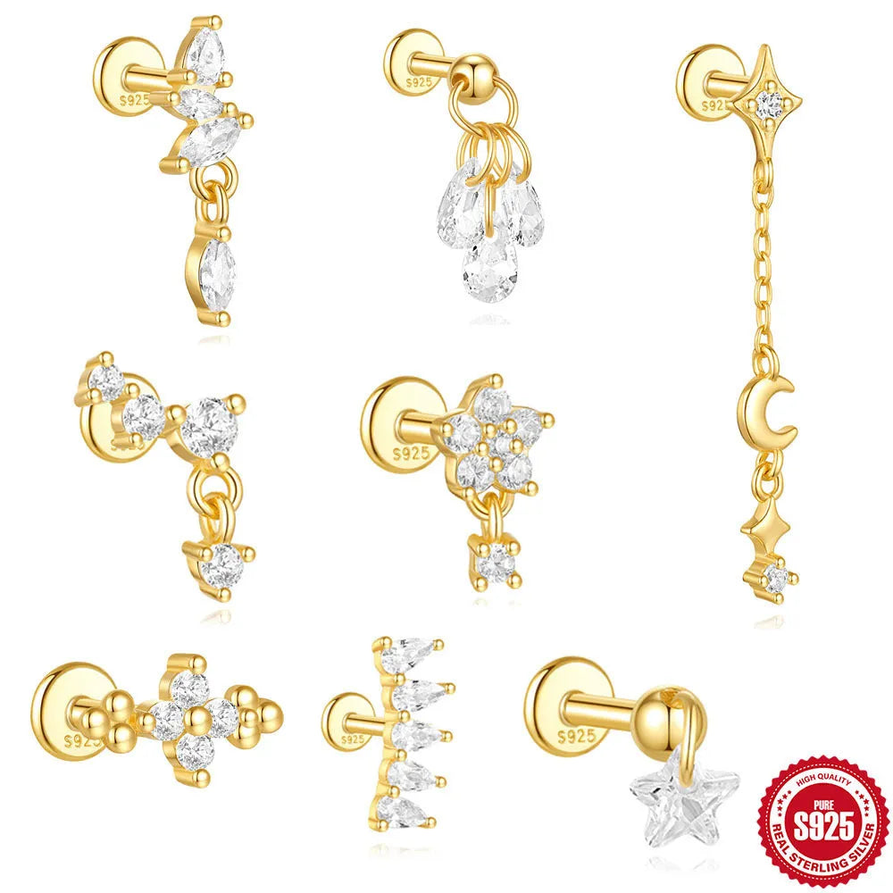 S925 sterling silver geometric moon and star earrings with diamond detail in a gold colour.