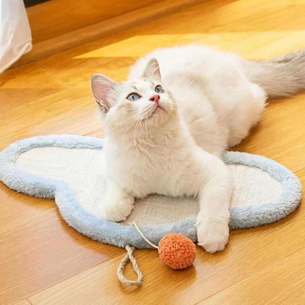 White wall-mounted cat scratching mat with natural sisal surface and sleeping cat cartoon design