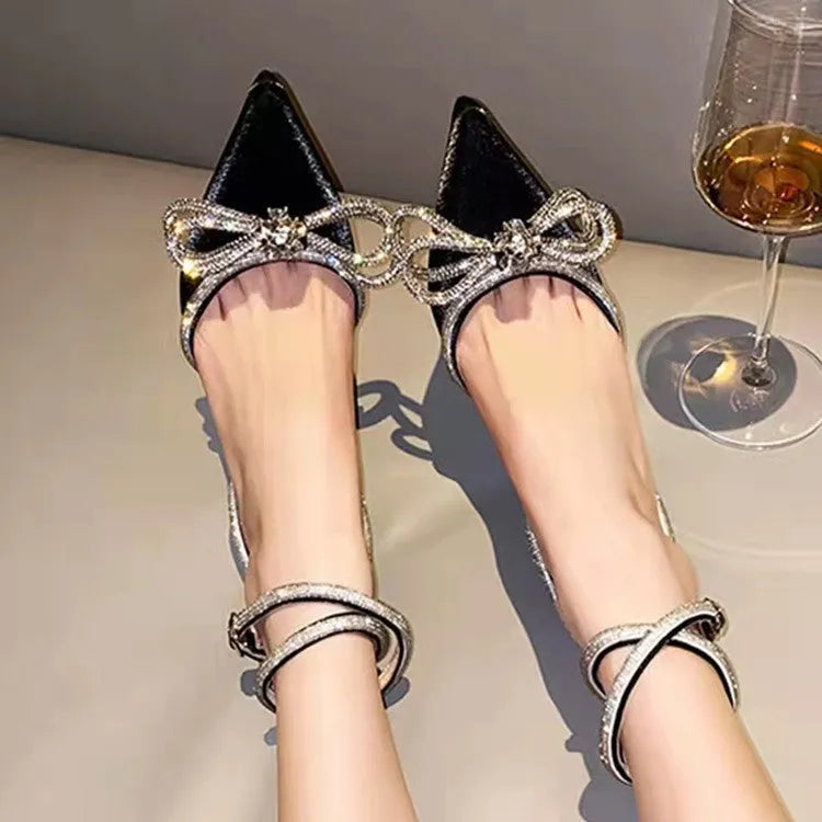 Women's black stiletto heel sandals with silk bandage back and buckle fastening, pointed toe.