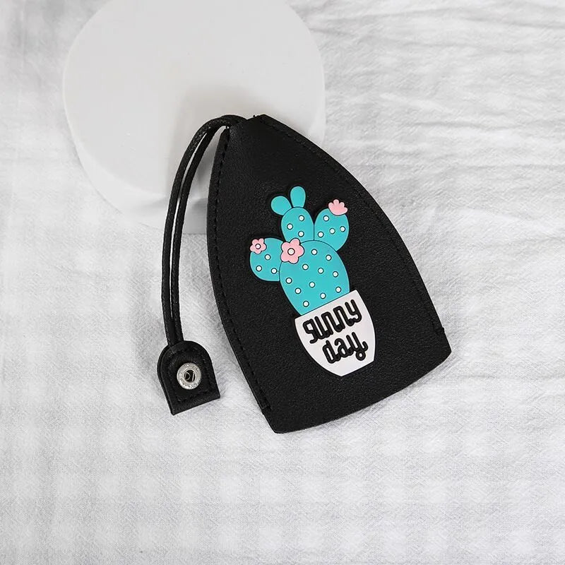 Colourful cartoon pull-out key case made from PU leather, showing the key extended from its protective sleeve.