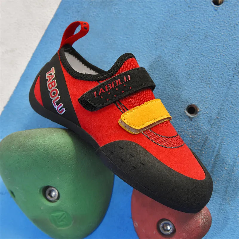 Beginner unisex rock climbing shoes with Velcro strap in black and red colour option.