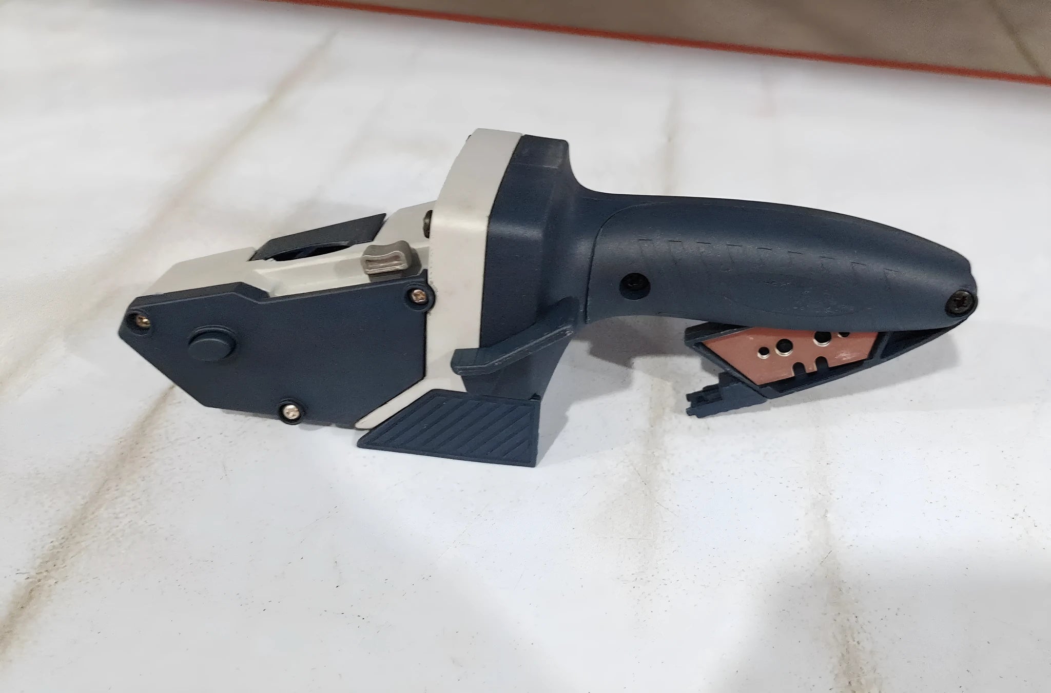 Blue aluminium alloy and TPR plastic DIY cutting tool with lock mechanism and measurement scale.