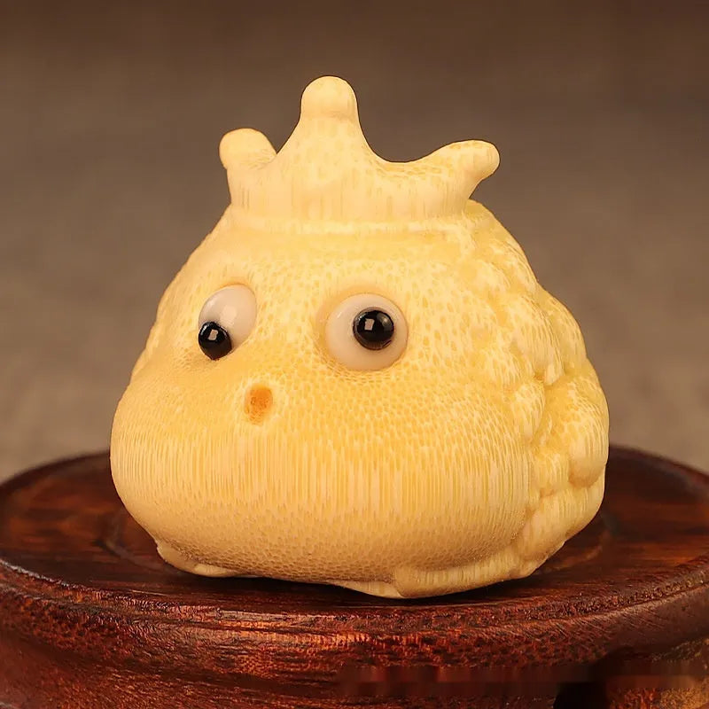 Hand-carved bamboo sculpture of a cute Crown Princess toad ornament.