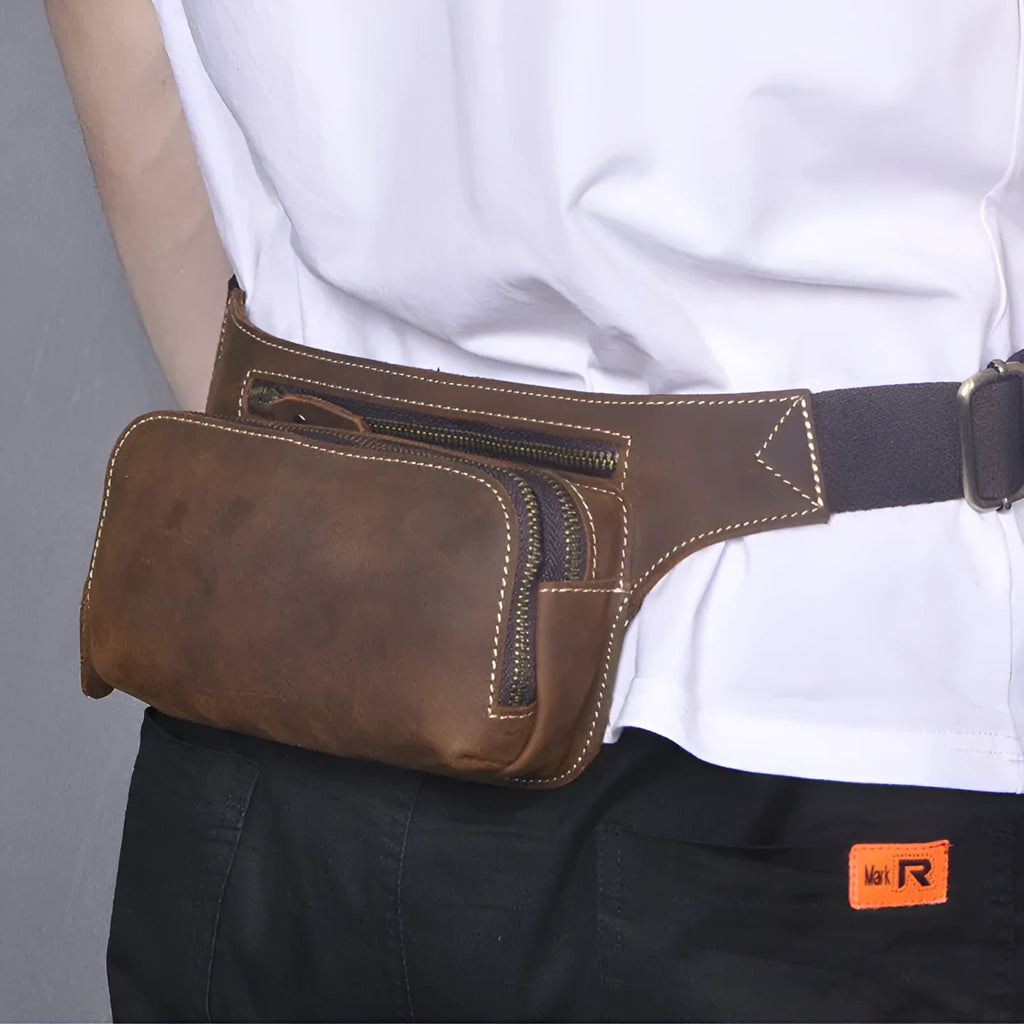Brown cowhide leather men's sports waist bag with a zip closure.