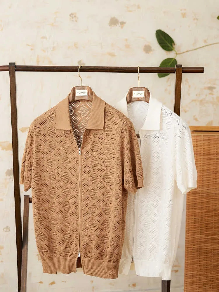 Light brown cotton short sleeve cardigan with zip front and lapel collar laid flat.