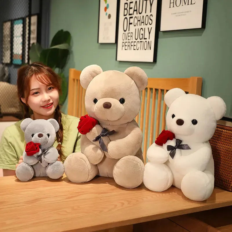 Rose bear plush toy in beige, brown, or grey, shown in sizes from 23cm to 45cm.