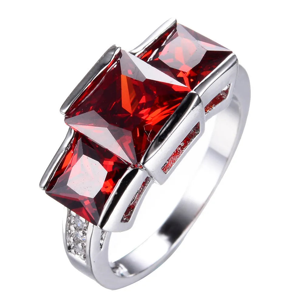 A geometric copper ring in multiple colour options on a size chart showing rings 6 to 10.