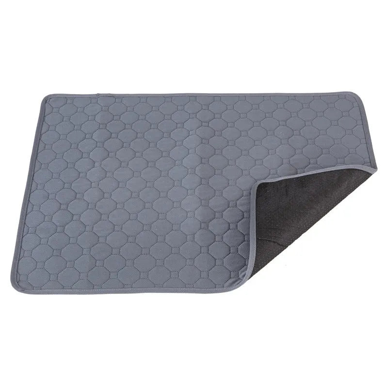 Washable tan and grey reusable dog pee pad on a wooden floor