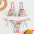 Black women's swimsuit with lace-up split front and backless briefs design