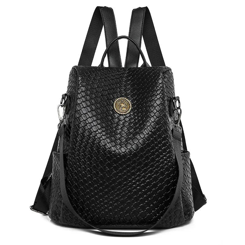Women's black anti-theft backpack with waterproof PU construction showing organisational pockets and stitching details