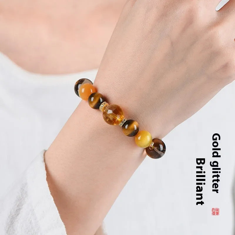 Natural yellow crystal bead bracelet with 10mm Jinba beads on wrist