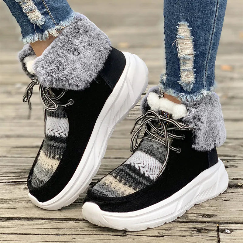 Beige women's lace-up suede snow boots with a thick sole and plush lining on a white background.