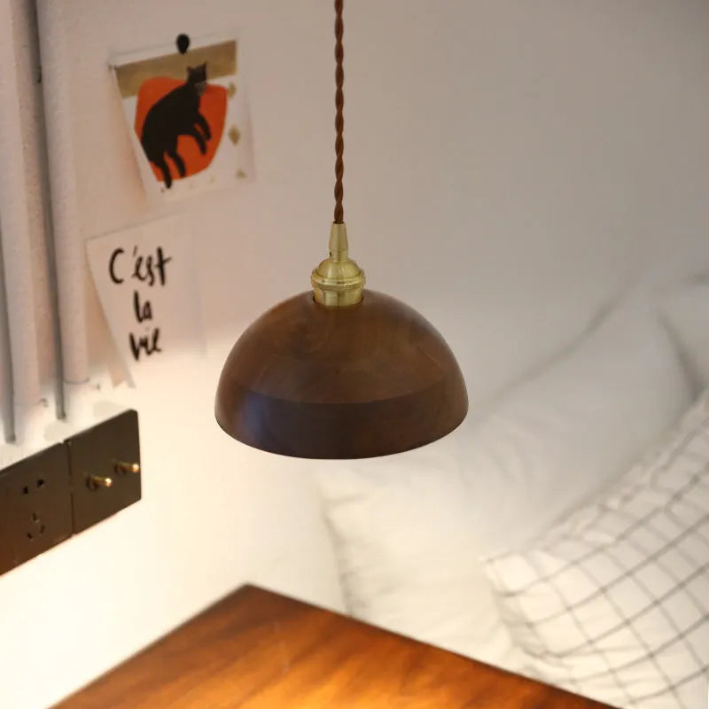 Close-up of a single-head droplight chandelier made from walnut wood art and copper, shown in one of four available colour styles.