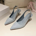 A pair of women's apricot suede stiletto heels with a pointed toe and thin high heel.