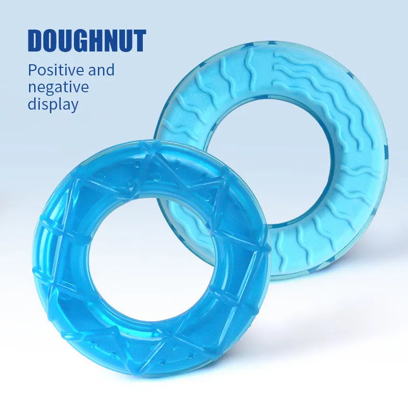 Set of three silicone dog toys: a blue pacifier, a red popsicle, and a green ring for water filling and freezing.