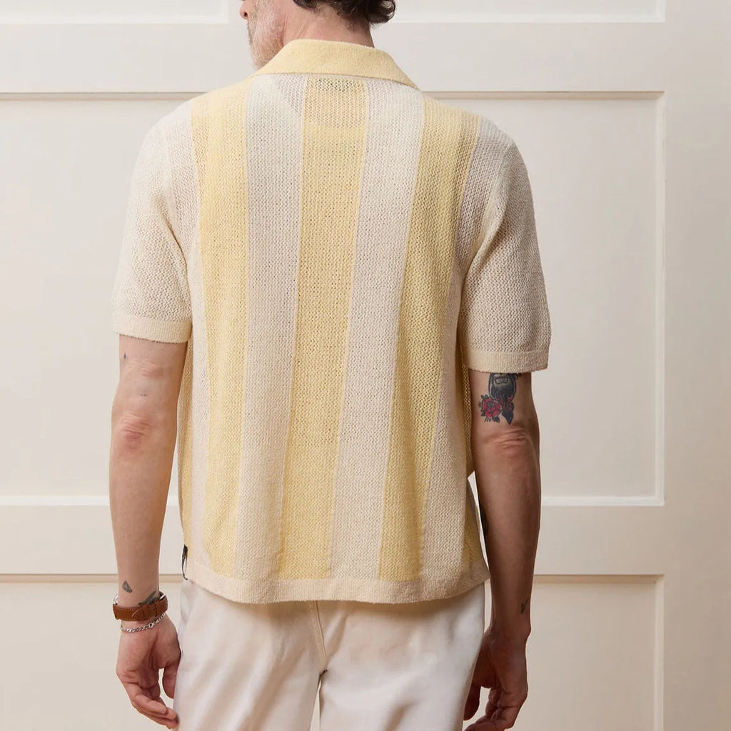 Yellow men's casual polo shirt with asymmetric design and short sleeves made from Tencel fabric.