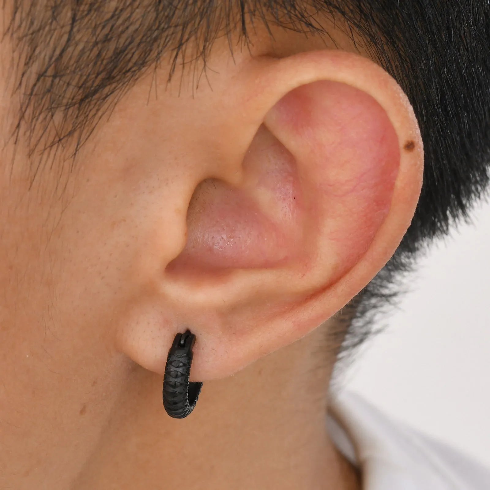 Stainless steel snake pattern earrings for men in black and gold options