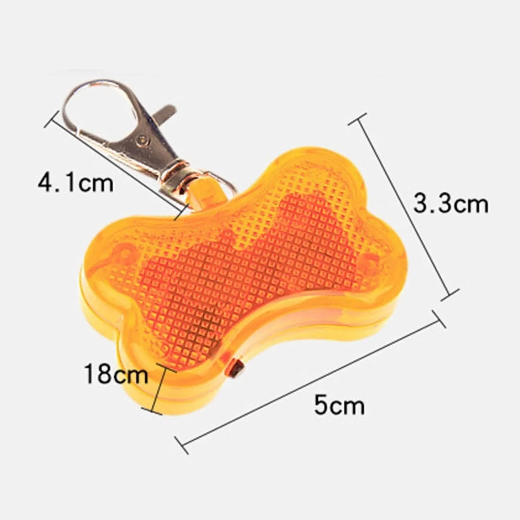 Plastic bone-shaped LED light pendant for attaching to a pet dog or cat collar.