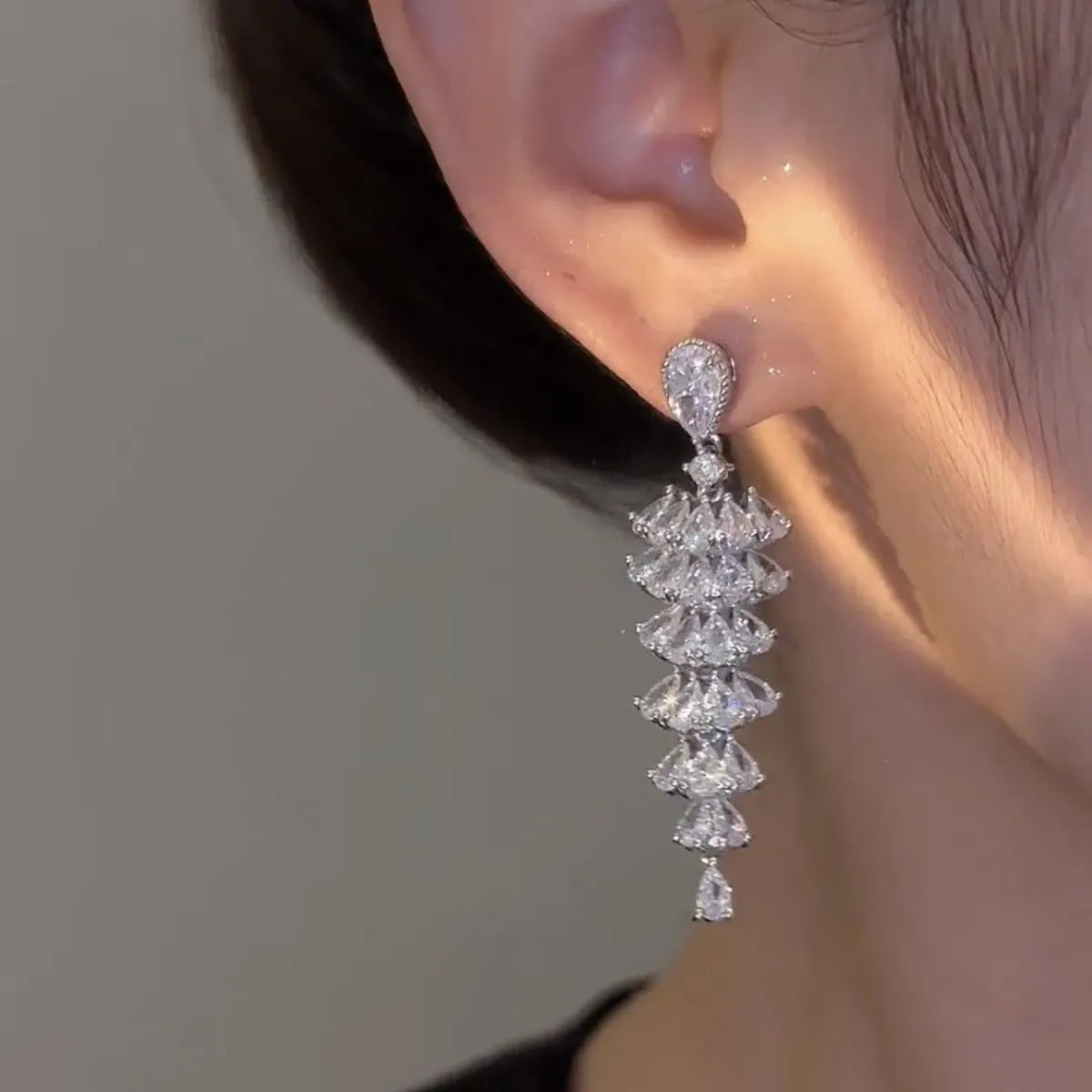 Silver pagoda colour zircon Christmas tree shaped drop dangle earrings on a stud fastening.