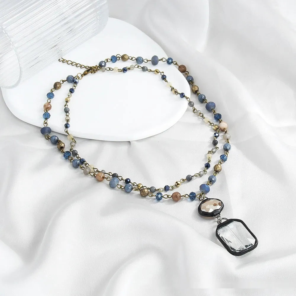 Tribal style adjustable necklace with stone and glass pendants in 2-layer design