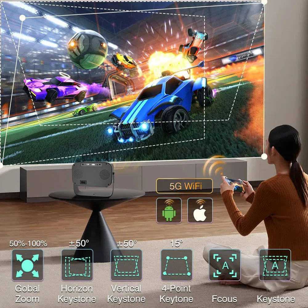 Black portable smart projector with remote control and cables on desk