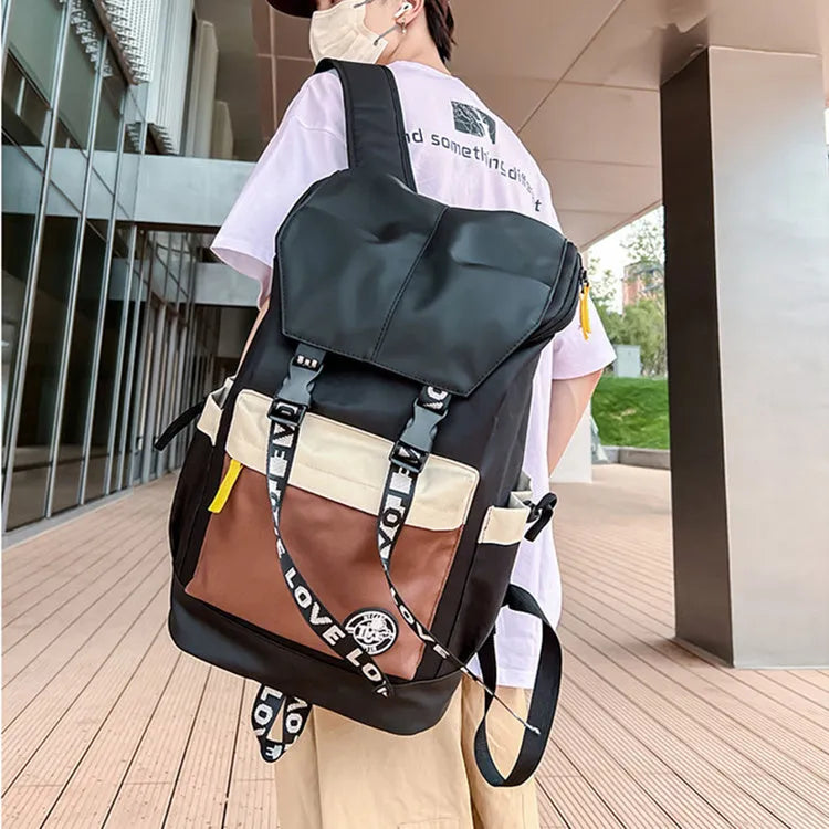 Oxford cloth backpack for junior high students in black, green or red with three carrying options.