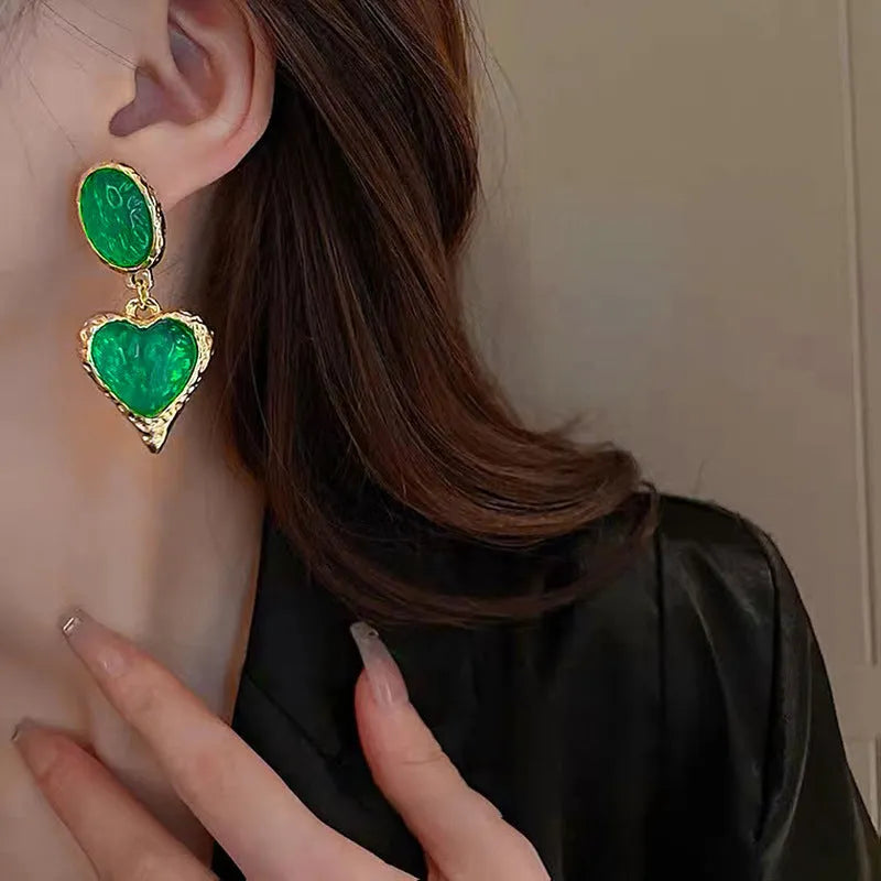 Silver pleated oval love heart stud earrings in alloy, showing green, purple, red, and yellow white colour options.