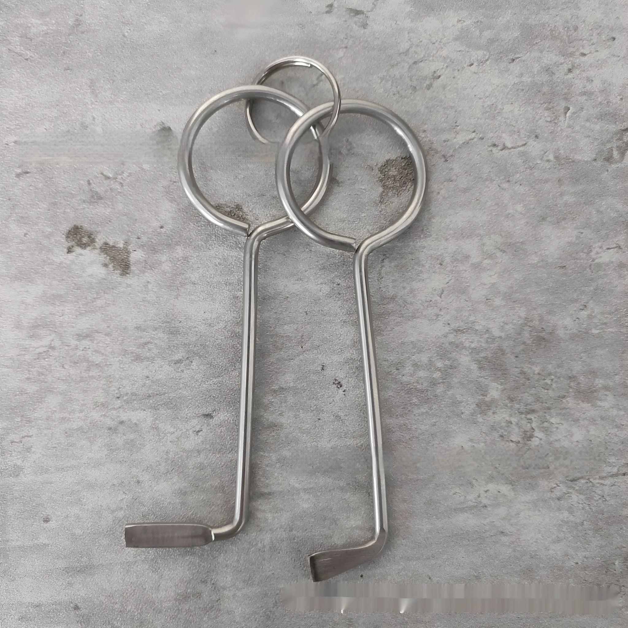 Two alloy wrench tools from portable maintenance set on plain background