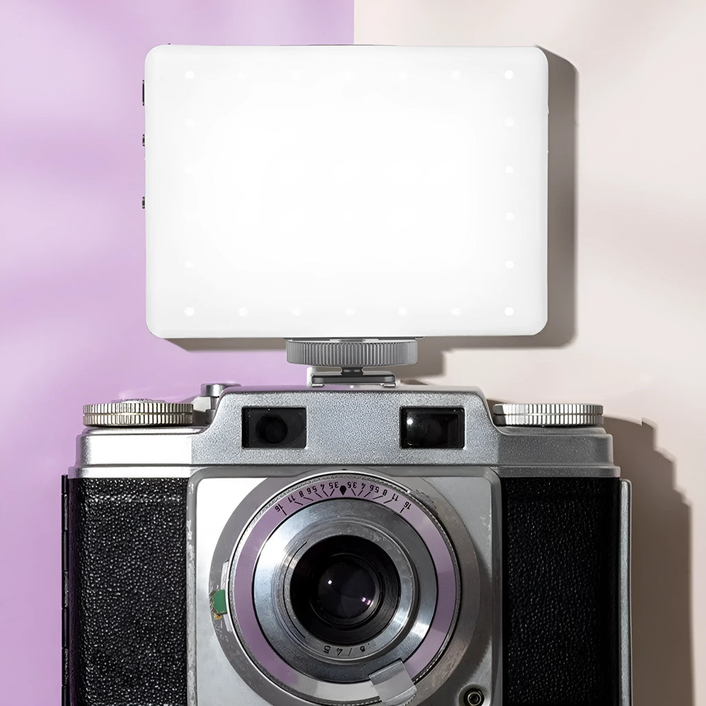 VL series pocket LED fill light with clip attached to a smartphone for photography.