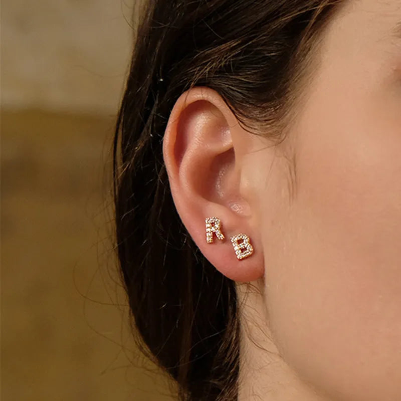 Brass gold-plated alphabet earrings showing single capital letter designs from A to Z with zircon elements
