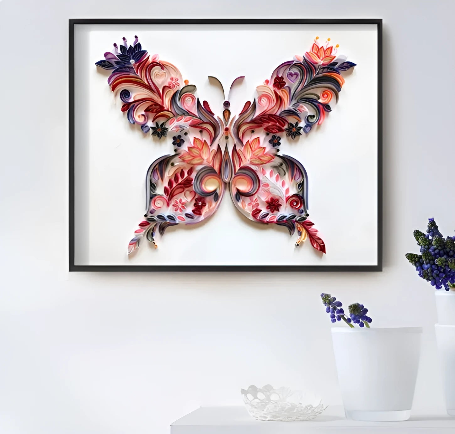 20 inch handmade butterfly quilling paper ornament with craft tools on blue background
