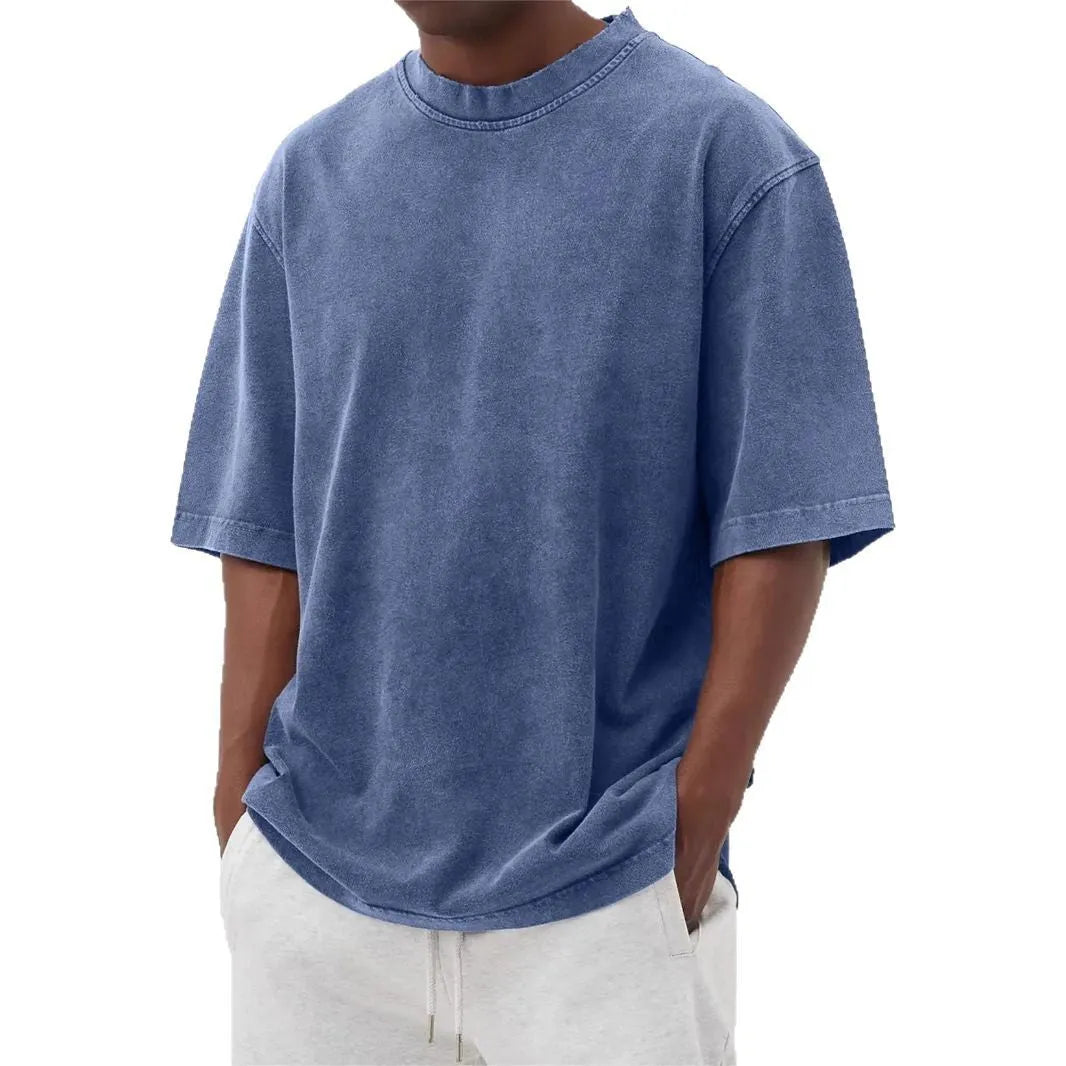 Men's stone-washed distressed loose fit t-shirt in army green colour on a hanger.