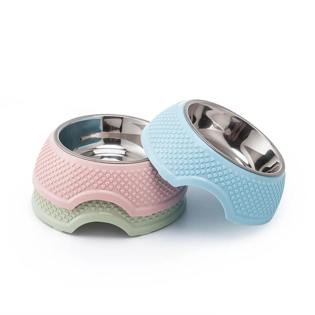 Set of four stainless steel pet bowls with non-slip bases in blue, green, and pink colours