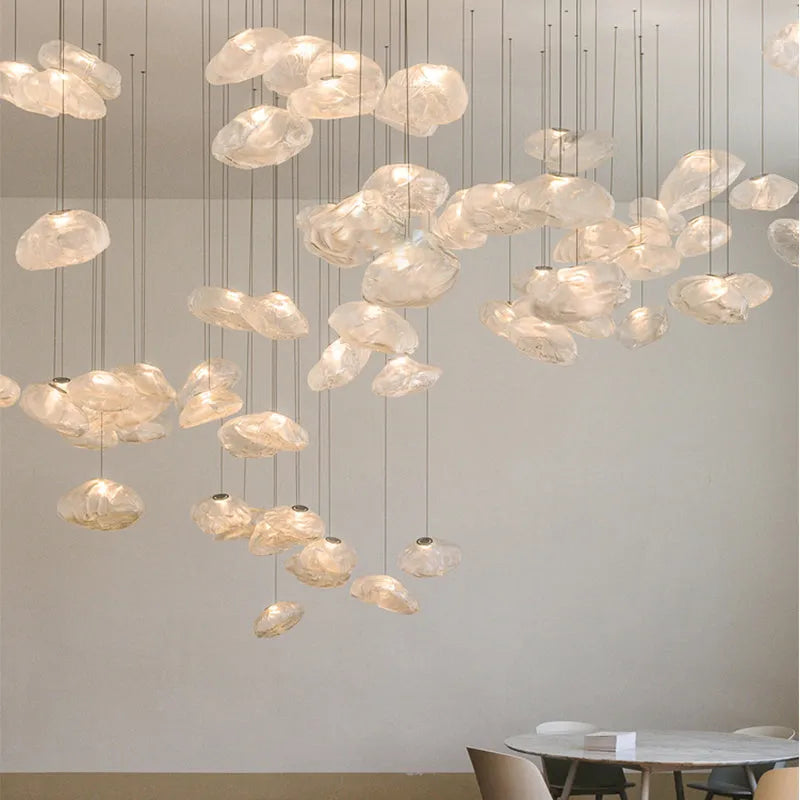 Modern glass decorative chandelier light fixture in amber, clear or smoke grey colour.