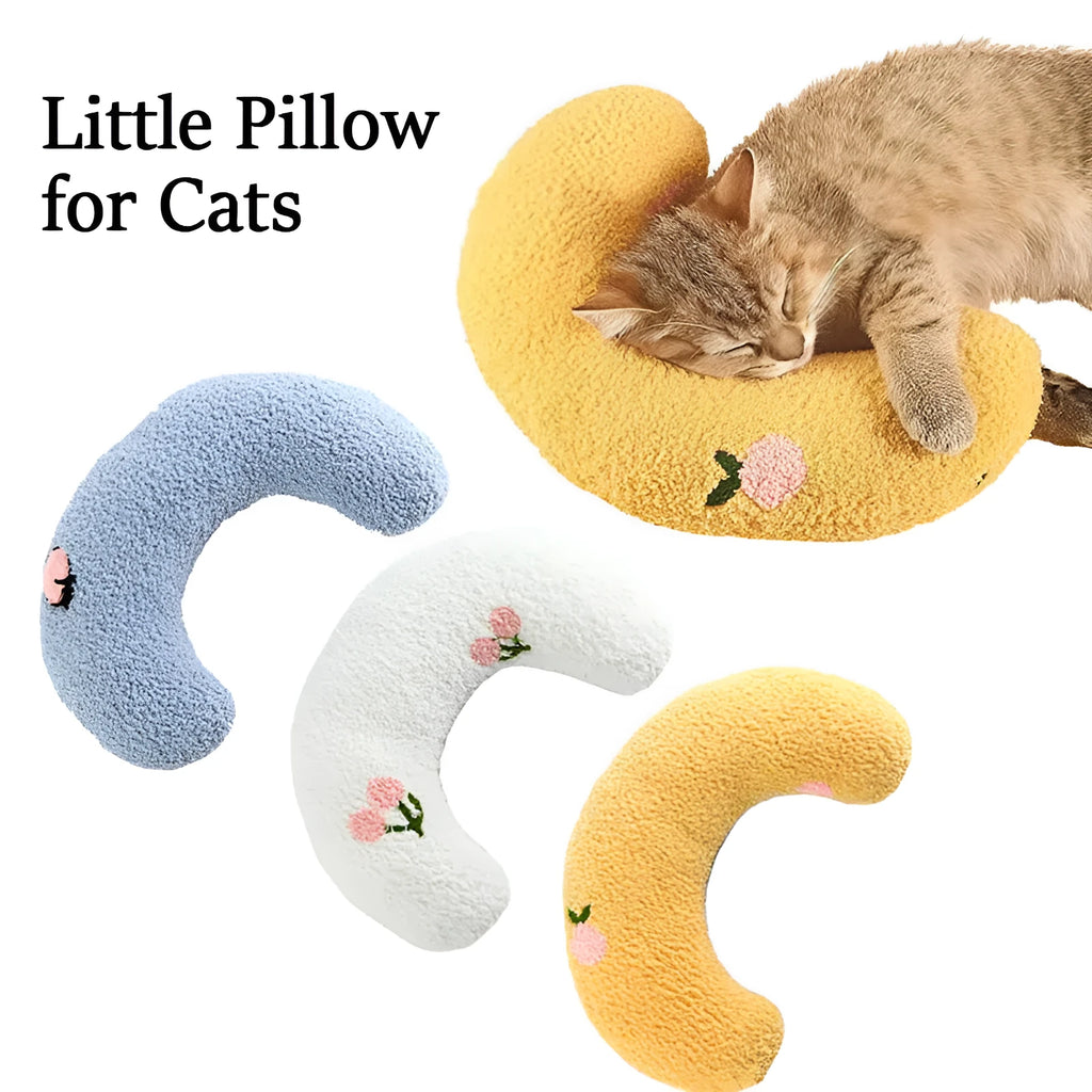 Small U-shaped plush pillow for cats and small dogs in blue colour, showing quilted faux fur texture.