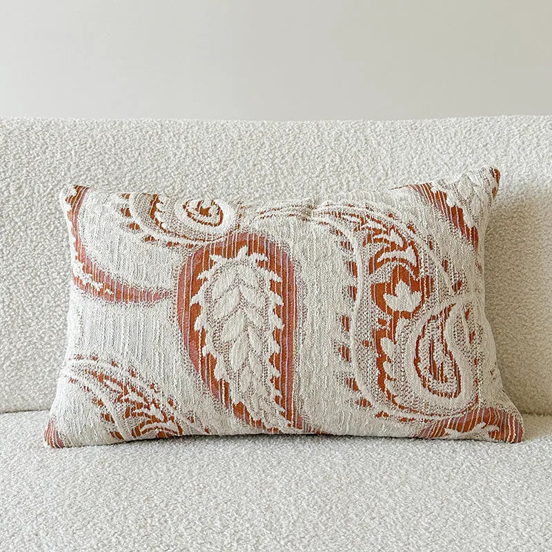 American-style jacquard paisley decorative pillow cover in amber tones on a sofa, showing square and rectangular size options.