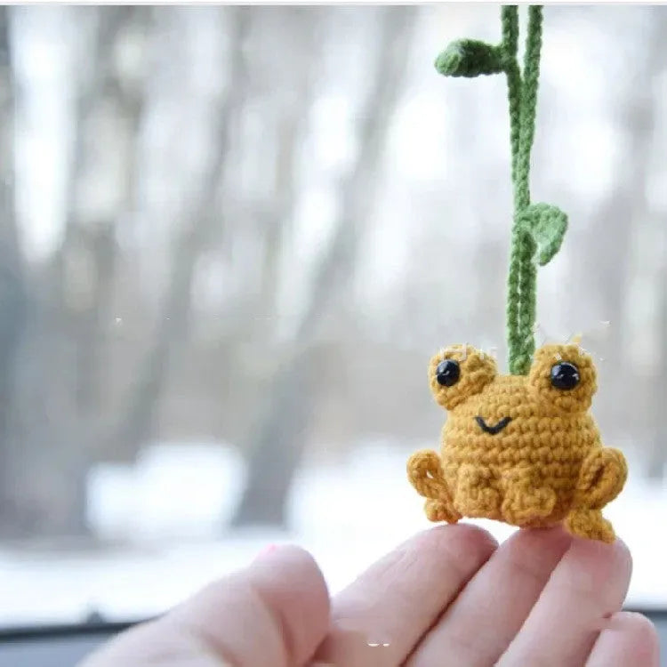 Handmade green plush frog woven car pendant hanging, showing soft texture and cartoon design.