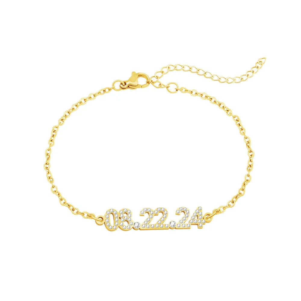 Stainless steel digital bracelet with diamond-studded face on a wrist.