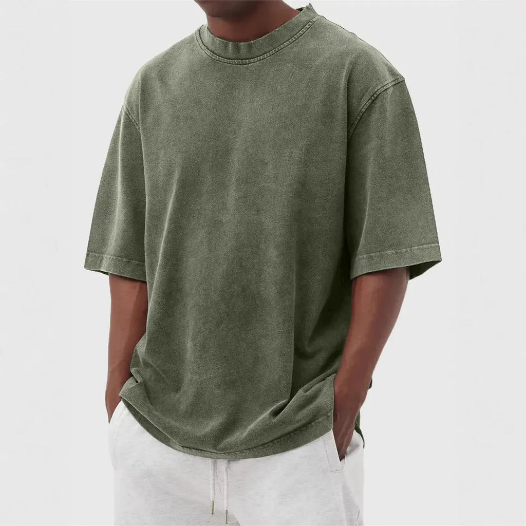 Men's stone-washed distressed loose fit t-shirt in army green colour on a hanger.