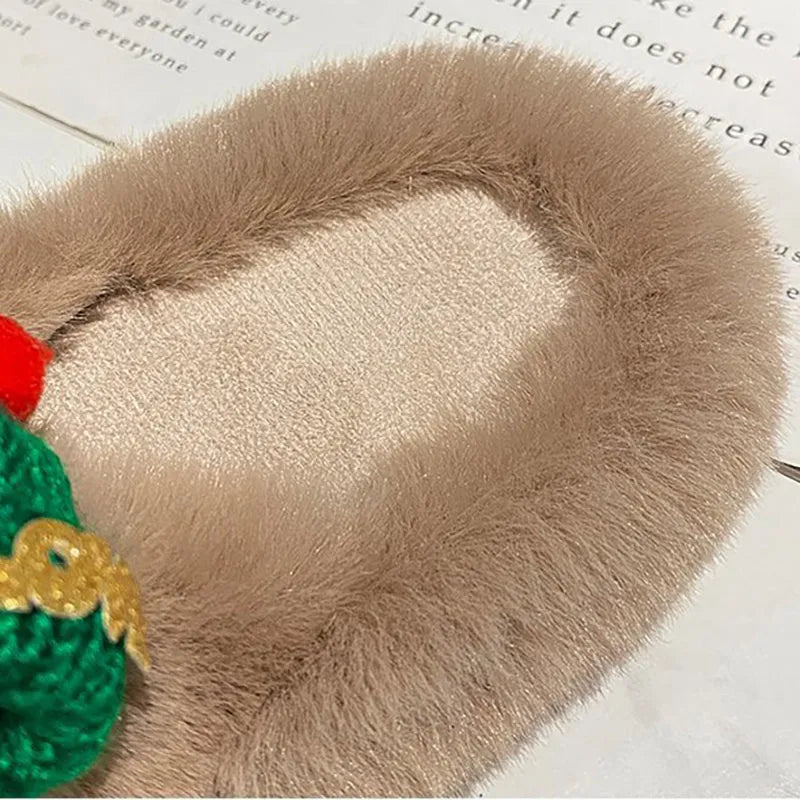 Women's black Christmas hat decoration faux plush slippers with a rubber sole.