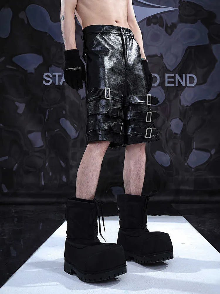 Men's black PU leather casual cropped shorts showing medium-low waist and polycarbaminate fibre material.