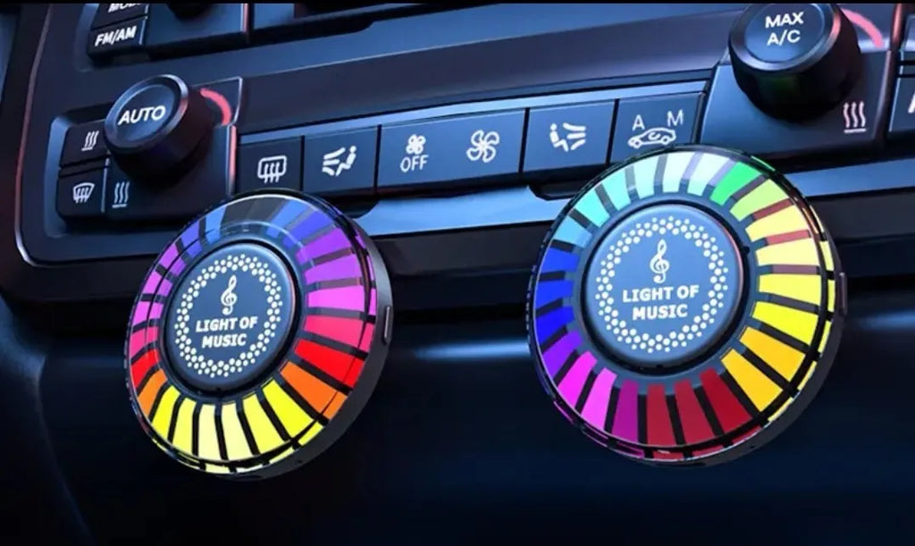 Car air vent aromatherapy unit with colourful RGB lights and a 3D vent clip attachment.