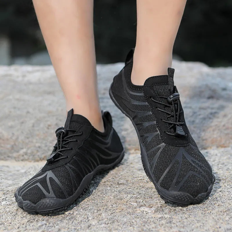 Breathable men's and women's low-top running shoes in a colour option with a lace-up front and rubber sole.