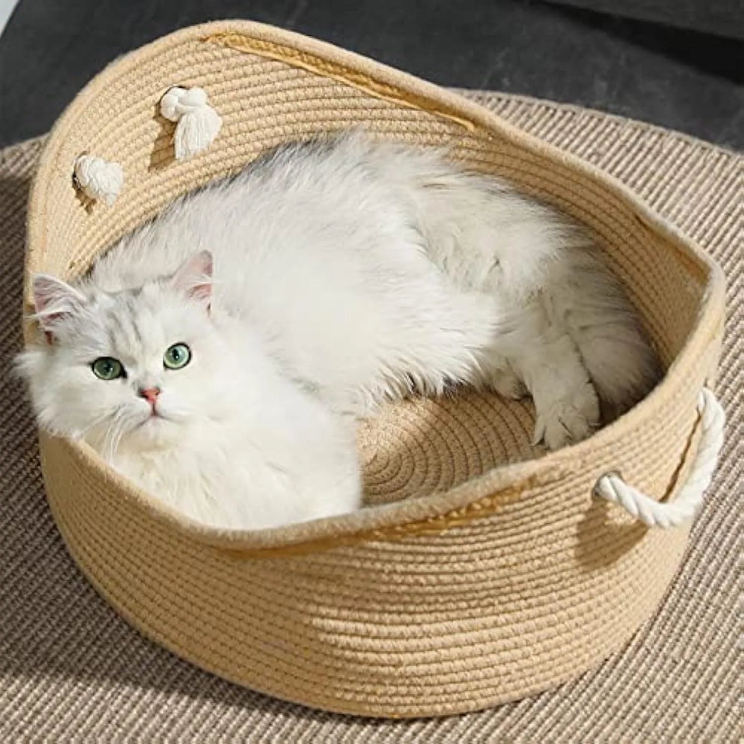 Wicker cat bed basket with a corrugated scratching surface, shown in two sizes.