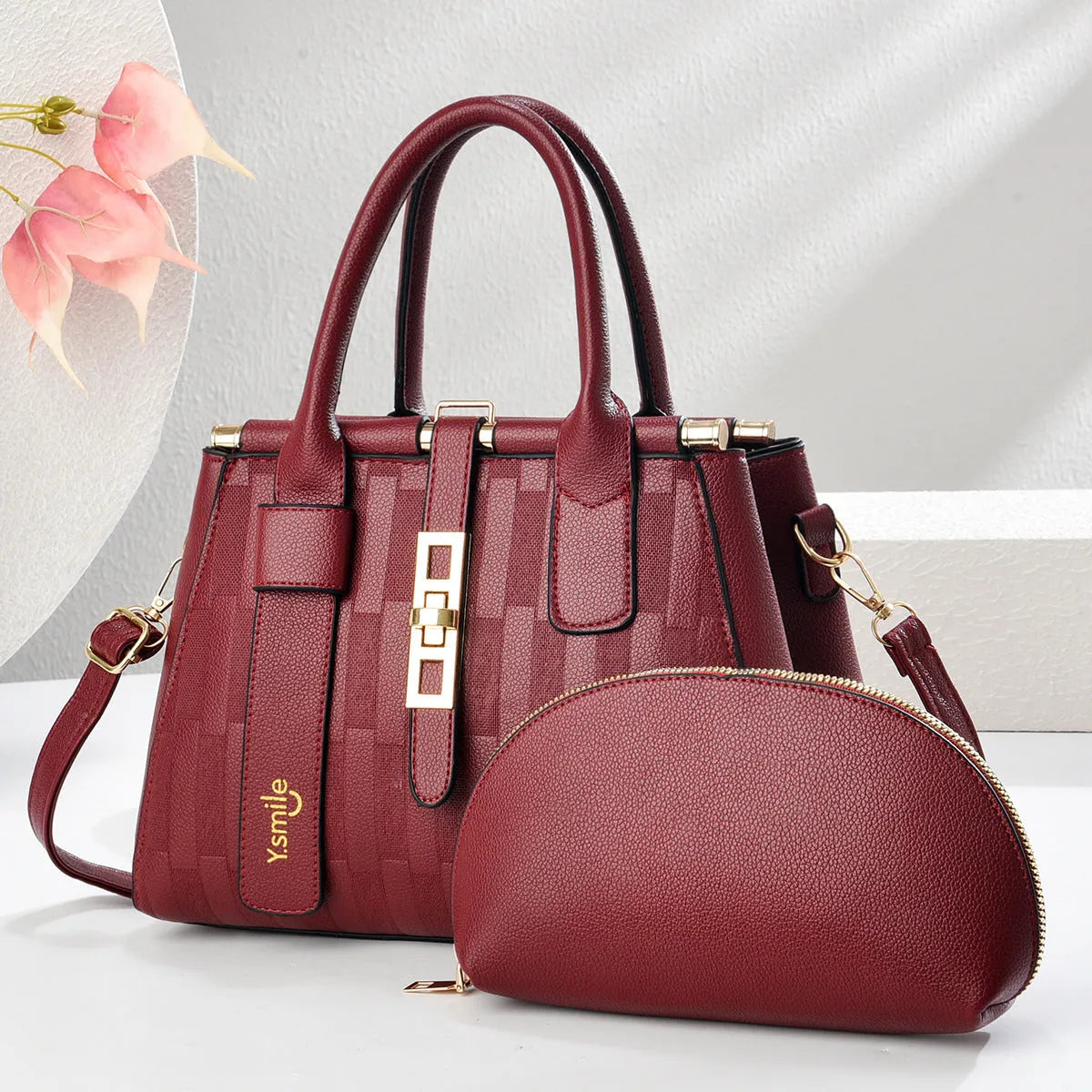 Round PU leather crossbody shoulder bag in black, shown with adjustable strap and measuring 28cm wide.