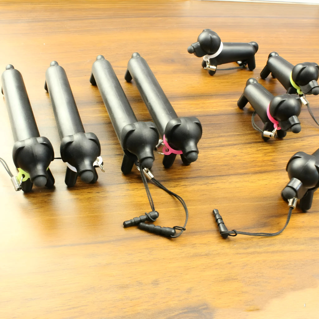 Black puppy-shaped touch screen stylus with extendable design and phone stand functionality