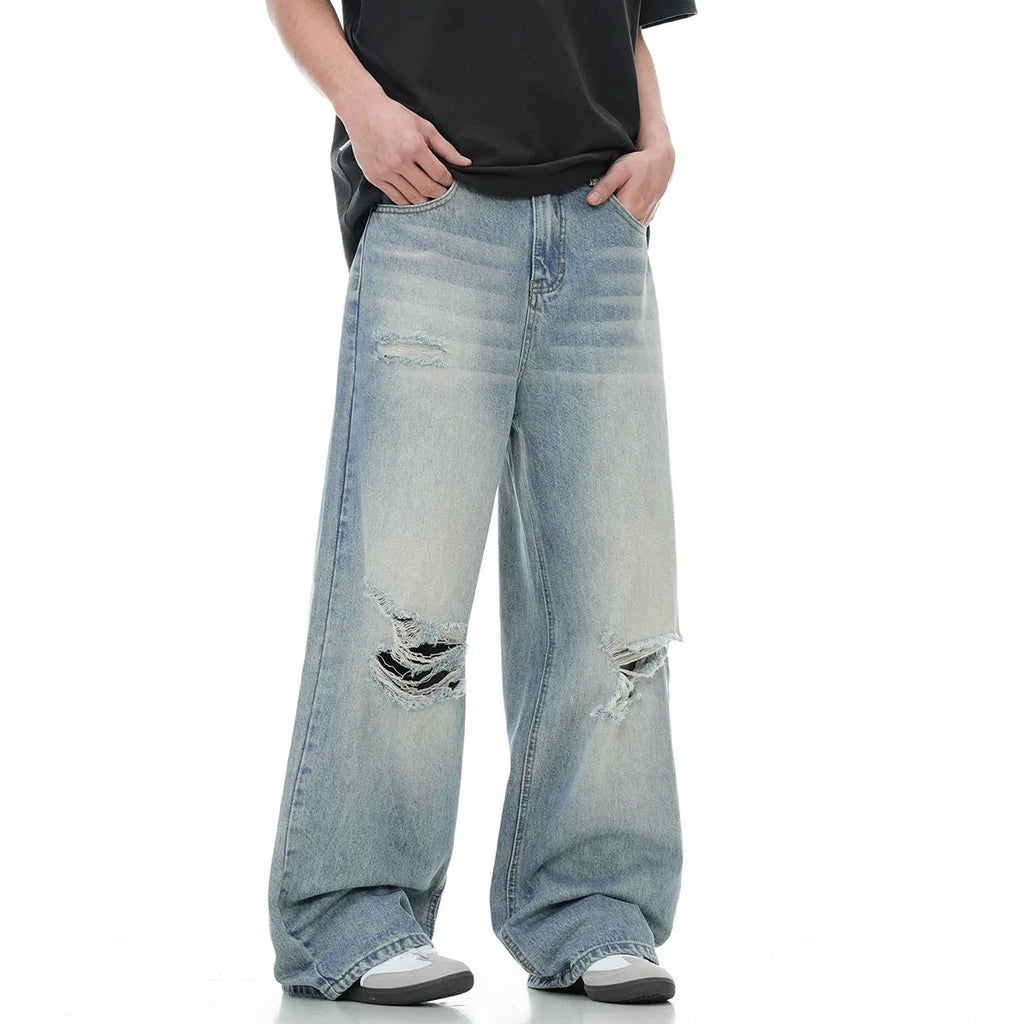 Blue straight-leg men's jeans with a zipper fly on a plain background.