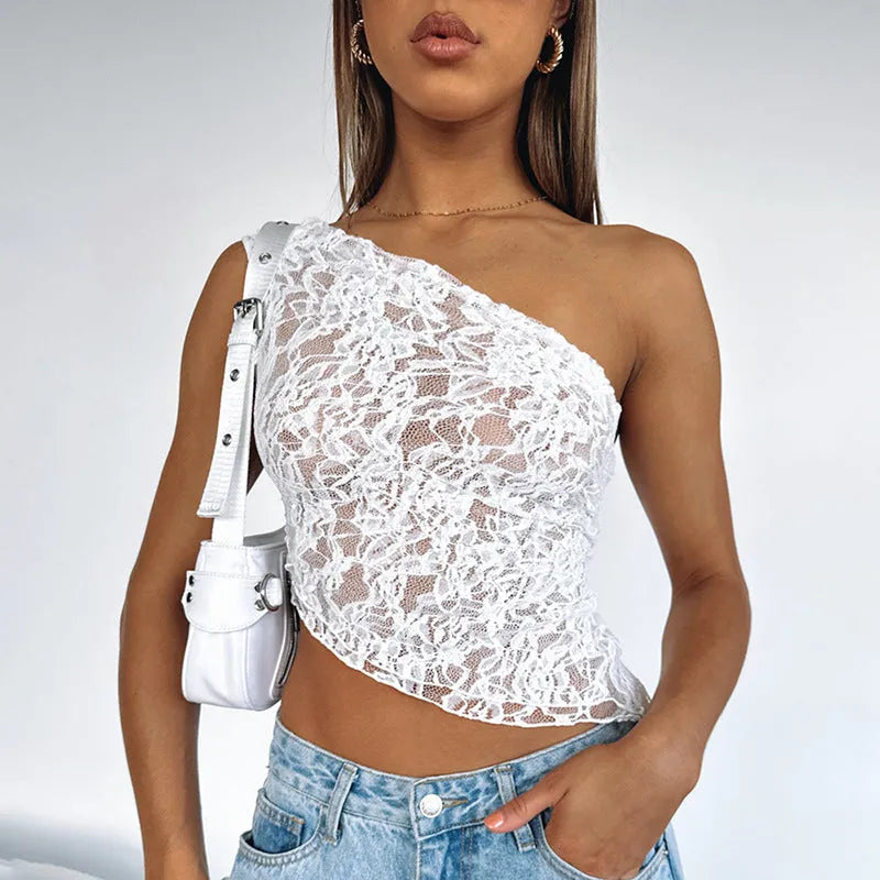 Women's apricot sleeveless vest top with lace back panel and asymmetrical neckline on a hanger.