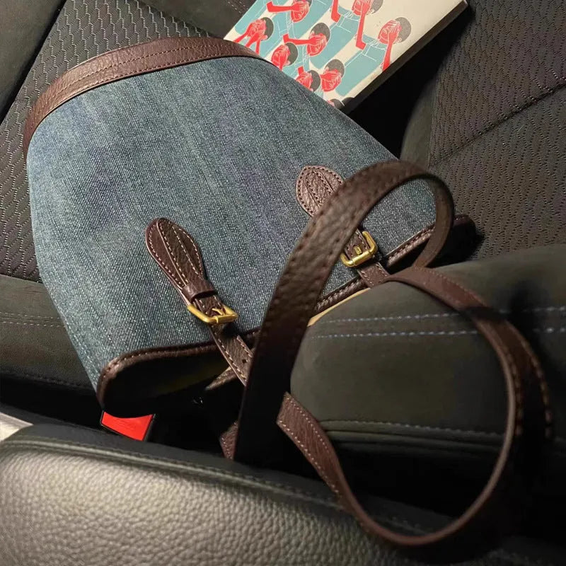 Denim patchwork handbag with one-shoulder bucket design showing dimensions
