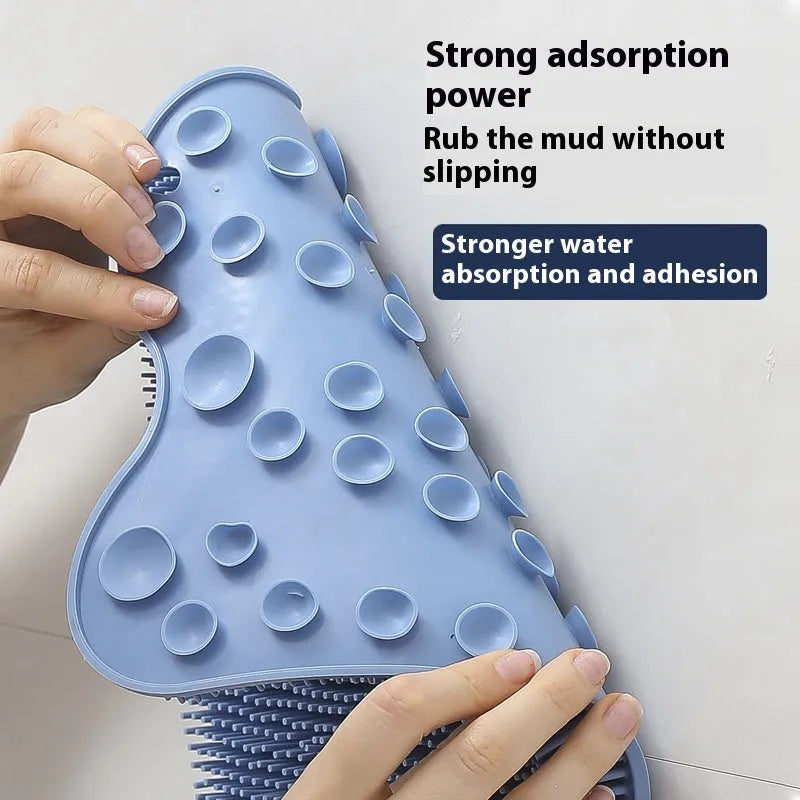 Blue silicone bath massage cushion with textured surface measuring 31 by 32 centimetres